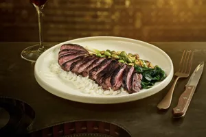 Skirt steak served over jasmine rice and cucumber edamame salad, The Hollywood Rooftop