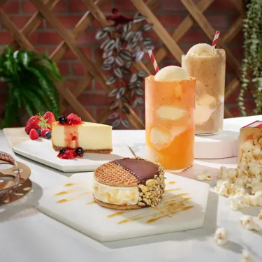Desert Spread. Cheesecake, a choco sando, root beer floats, and popcorn.